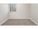 Small bedroom with neutral walls, carpet flooring and a window at 100 Spicewood Ct, South Fulton, GA 30349