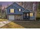 Two-story house with gray siding and stone accents at 100 Spicewood Ct, South Fulton, GA 30349