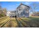 Gray house exterior with deck and yard at 100 Spicewood Ct, South Fulton, GA 30349