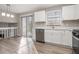 Eat-in kitchen with white cabinets, stainless steel appliances, and sliding glass door to patio at 100 Spicewood Ct, South Fulton, GA 30349