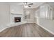 Living room with fireplace, hardwood floors, and neutral walls at 100 Spicewood Ct, South Fulton, GA 30349