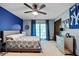 Blue bedroom with king-size bed and ceiling fan at 1440 Woodhill Dr, Marietta, GA 30066