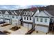 Aerial view of three-story townhome with two-car garage at 257 Whitetail Cir, Canton, GA 30115