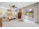 Main bedroom with king bed and access to deck overlooking golf course at 7312 Melrose Ct, Villa Rica, GA 30180