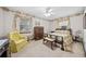 Charming bedroom with a queen bed and yellow armchair at 7312 Melrose Ct, Villa Rica, GA 30180
