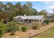 Brick house with a large deck and a partially fenced backyard at 7312 Melrose Ct, Villa Rica, GA 30180