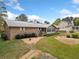 Brick home with a screened porch, deck, and spacious backyard at 7312 Melrose Ct, Villa Rica, GA 30180