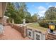 Brick porch with wrought iron gate and landscape view at 7312 Melrose Ct, Villa Rica, GA 30180