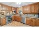 Modern kitchen featuring stainless steel appliances and granite counters at 7312 Melrose Ct, Villa Rica, GA 30180