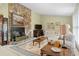 Spacious living room with stone fireplace and ample seating at 7312 Melrose Ct, Villa Rica, GA 30180