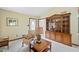 Living room featuring a comfy armchair and wooden cabinet at 7312 Melrose Ct, Villa Rica, GA 30180