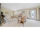 Bright living room with hardwood floors and multiple seating areas at 7312 Melrose Ct, Villa Rica, GA 30180