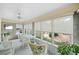 Bright sunroom with wicker furniture and view of backyard at 7312 Melrose Ct, Villa Rica, GA 30180