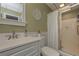 Bathroom with a walk-in shower and updated vanity at 2192 Weslan Dr, Austell, GA 30106