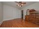 Bedroom with hardwood floors, built-in closet, and ceiling fan at 2192 Weslan Dr, Austell, GA 30106