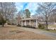 Brick Ranch home with a long driveway and mature trees at 2192 Weslan Dr, Austell, GA 30106