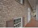 Brick facade with covered porch, shutters, and a walkway at 2192 Weslan Dr, Austell, GA 30106