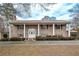 Ranch house with covered entry, landscaping, and a long driveway at 2192 Weslan Dr, Austell, GA 30106