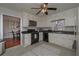 Updated kitchen with white cabinets, black appliances, and a view of the dining room at 2192 Weslan Dr, Austell, GA 30106