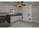 Kitchen with white cabinets, black countertops, and modern appliances at 2192 Weslan Dr, Austell, GA 30106