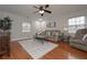 Spacious living room with hardwood floors, ceiling fan, and comfy furniture at 2192 Weslan Dr, Austell, GA 30106