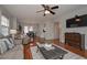 Open living space with hardwood floors, ceiling fan, and built-ins at 2192 Weslan Dr, Austell, GA 30106