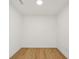 Simple bedroom with light walls and hardwood floors at 2425 Peachtree Ne Rd # 1106, Atlanta, GA 30305