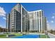 Modern high-rise building with a sleek design and rooftop amenities at 2425 Peachtree Ne Rd # 1106, Atlanta, GA 30305
