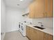 Modern laundry room features washer, dryer, and ample cabinetry at 2425 Peachtree Ne Rd # 1106, Atlanta, GA 30305