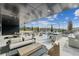 Relaxing outdoor patio with lounge seating, grilling stations, and a pool view at 2425 Peachtree Ne Rd # 1106, Atlanta, GA 30305