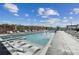 Expansive pool deck with lounge chairs and a hot tub at 2425 Peachtree Ne Rd # 1106, Atlanta, GA 30305