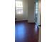 Bright bedroom with hardwood floors and large window at 3262 Carriage Way, Marietta, GA 30062