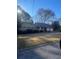 Ranch style home with a green exterior, large yard, and attached garage at 3262 Carriage Way, Marietta, GA 30062