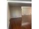 Spacious living room featuring hardwood floors and a fireplace at 3262 Carriage Way, Marietta, GA 30062