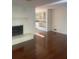 Living room with hardwood floors, fireplace and built-in shelving at 3262 Carriage Way, Marietta, GA 30062