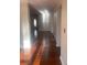 Hardwood floor living room with sunlit entryway at 3262 Carriage Way, Marietta, GA 30062