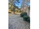 Landscaped side yard with mature trees and shrubs at 3262 Carriage Way, Marietta, GA 30062