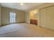 Bedroom with double closets, an ensuite vanity, and neutral carpeting at 1216 Valley Dr, Conyers, GA 30012