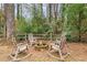 Relaxing fire pit area with four rocking chairs at 705 Barrington Way, Roswell, GA 30076