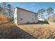 Tan house exterior with fenced backyard at 3683 Rolling Pl, Conley, GA 30288