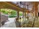 Covered patio with stone floor and glass table at 6206 Zell Miller Nw Path, Acworth, GA 30101