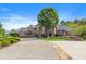 Brick home with a large driveway and lush landscaping at 6206 Zell Miller Nw Path, Acworth, GA 30101