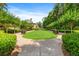 Landscaped backyard with manicured lawn and neatly trimmed hedges at 6206 Zell Miller Nw Path, Acworth, GA 30101