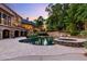 Inviting pool and spa surrounded by stone and lush landscaping at 6206 Zell Miller Nw Path, Acworth, GA 30101