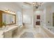 Spa-like bathroom with a soaking tub and vanity area at 6206 Zell Miller Nw Path, Acworth, GA 30101