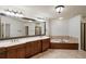 Large bathroom with double sinks, soaking tub, and large mirror at 6206 Zell Miller Nw Path, Acworth, GA 30101