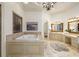 Luxurious bathroom featuring a large soaking tub and double sinks at 6206 Zell Miller Nw Path, Acworth, GA 30101