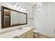 Elegant bathroom with a large vanity mirror and chandelier at 6206 Zell Miller Nw Path, Acworth, GA 30101