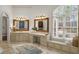 Elegant bathroom with double vanities and large window at 6206 Zell Miller Nw Path, Acworth, GA 30101