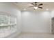 Bright bedroom with large window, ceiling fan, and plush carpeting at 6206 Zell Miller Nw Path, Acworth, GA 30101